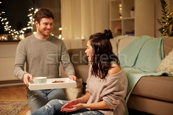 happy couple with food on tray at home Stock photo © dolgachov