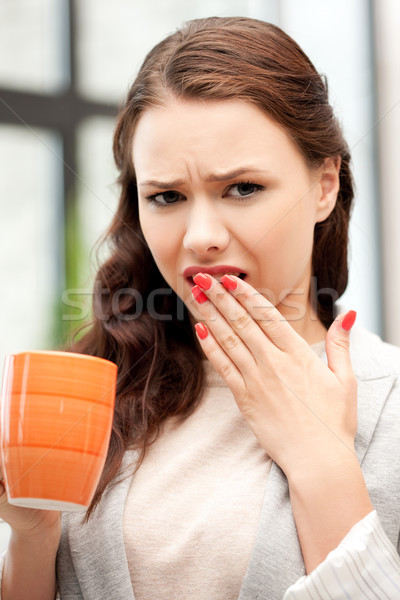 lovely businesswoman with mug Stock photo © dolgachov