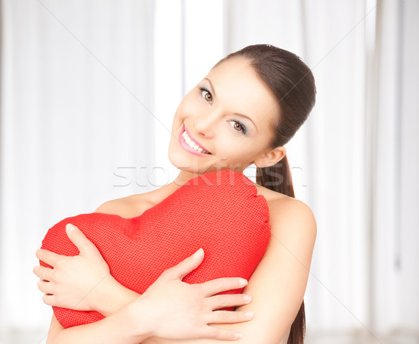 woman with red heart-shaped pillow Stock photo © dolgachov