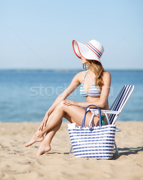 girl sunbathing on the beach chair Stock photo © dolgachov