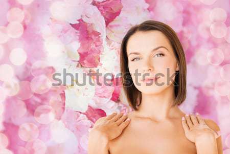 beautiful woman spraying pefrume on her neck Stock photo © dolgachov