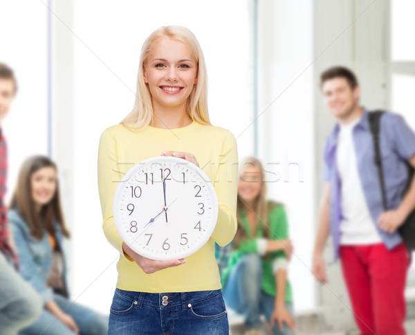 student with wall clock Stock photo © dolgachov