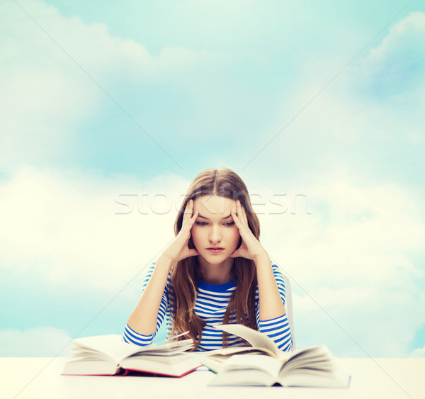 stressed student girl with books Stock photo © dolgachov