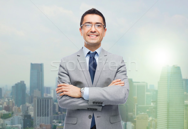 Stock photo: happy smiling businessman in eyeglasses and suit