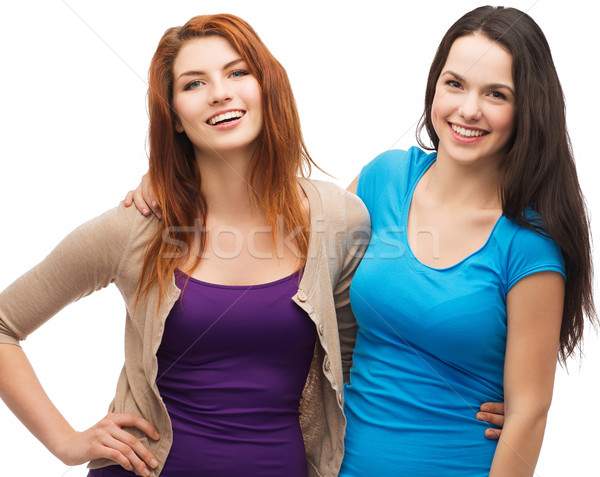 two laughing girls hugging Stock photo © dolgachov