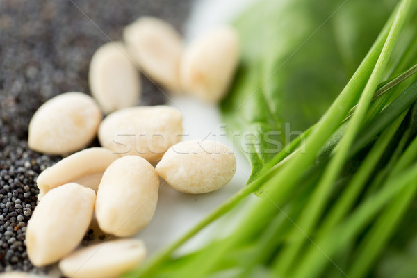 close up of peeled peanuts, greens and seeds Stock photo © dolgachov