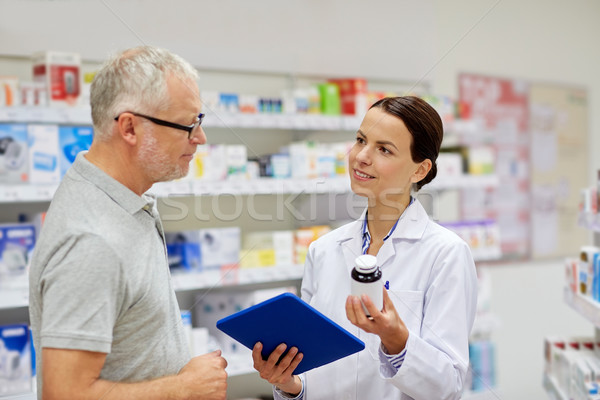 pharmacist with tablet pc and senior man Stock photo © dolgachov