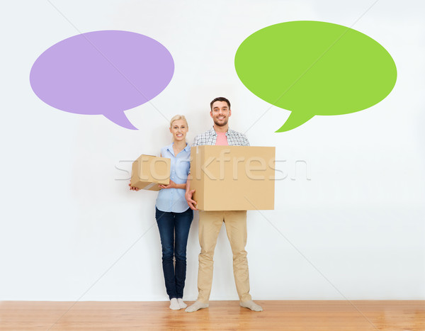 couple with cardboard boxes moving to new home Stock photo © dolgachov