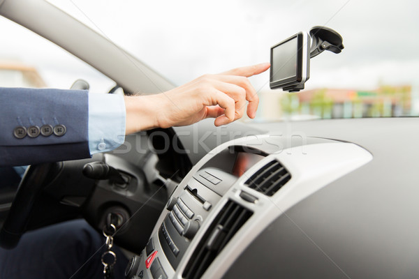 close up of man with gps navigator driving car Stock photo © dolgachov