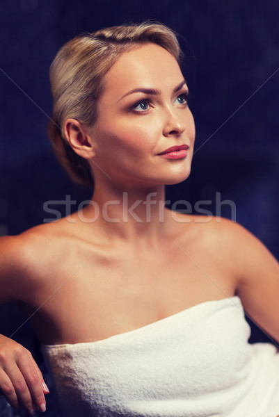 Stock photo: beautiful young woman sitting in bath towel