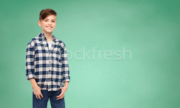 Souriant garçon à carreaux shirt jeans école [[stock_photo]] © dolgachov