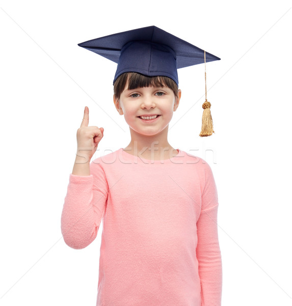 happy girl in bachelor hat or mortarboard Stock photo © dolgachov