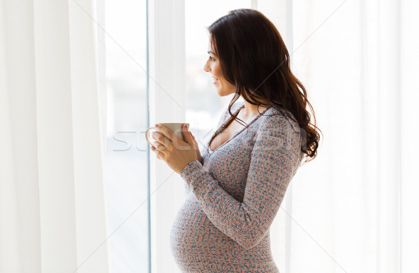 Donna incinta finestra gravidanza bevande Foto d'archivio © dolgachov