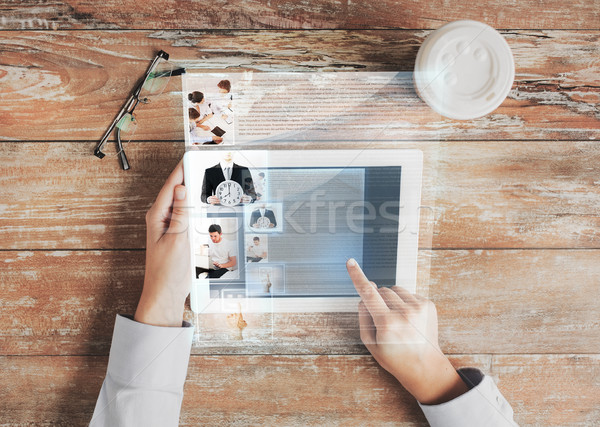 close up of hands with tablet pc and web page Stock photo © dolgachov