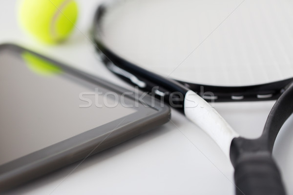 Közelkép teniszütő labda táblagép sport fitnessz Stock fotó © dolgachov