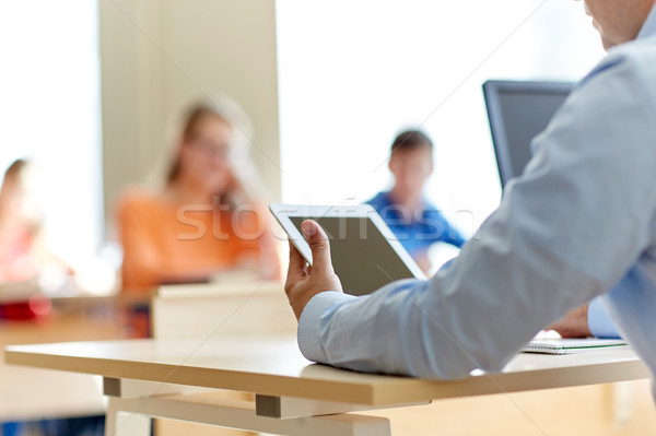 students and teacher with tablet pc at school Stock photo © dolgachov