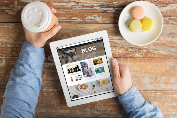 close up of hands with internet blog on tablet pc Stock photo © dolgachov