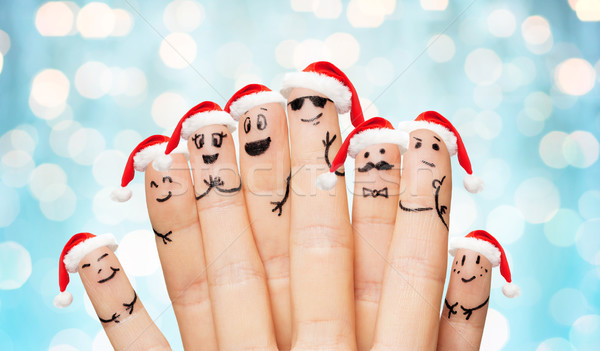 close up of hands and fingers with smiley faces Stock photo © dolgachov