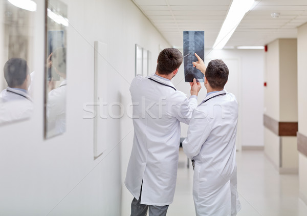medics with spine x-ray scan at hospital Stock photo © dolgachov