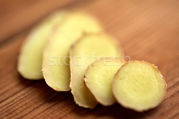 close up of ginger root on wooden table Stock photo © dolgachov