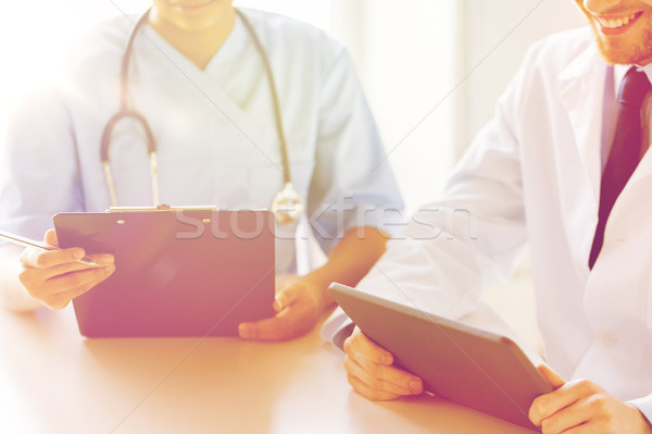 Stock photo: doctors with tablet pc and clipboard at hospital