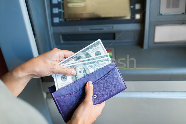 close up of hand withdrawing money at atm machine Stock photo © dolgachov