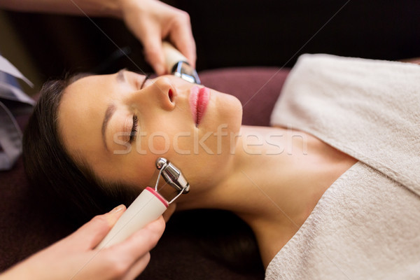 woman having hydradermie facial treatment in spa Stock photo © dolgachov