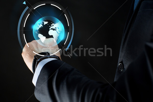 close up of businessman hand with smartwatch Stock photo © dolgachov