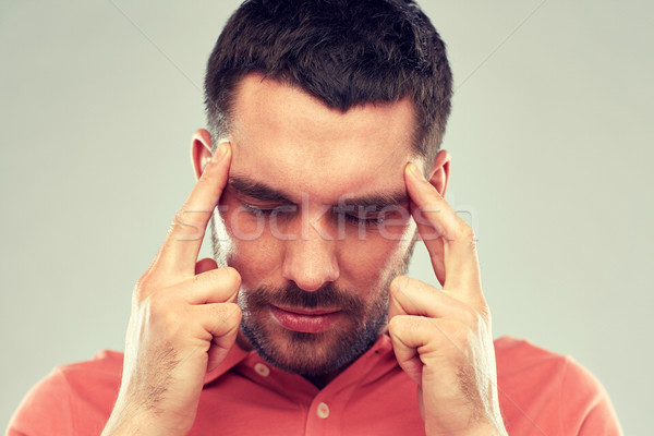 man suffering from head ache or thinking Stock photo © dolgachov