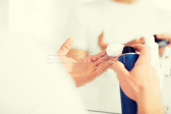 Stock photo: close up of man with shaving foam spray