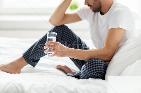 Homme lit verre eau maison personnes [[stock_photo]] © dolgachov