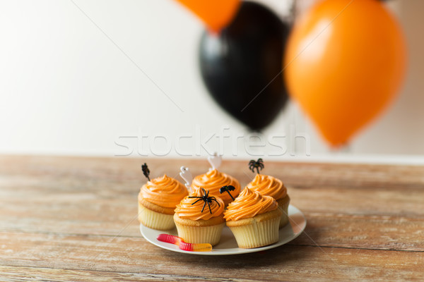 halloween party decorated cupcakes on plate Stock photo © dolgachov