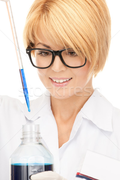 Stock photo: lab worker holding up test tube