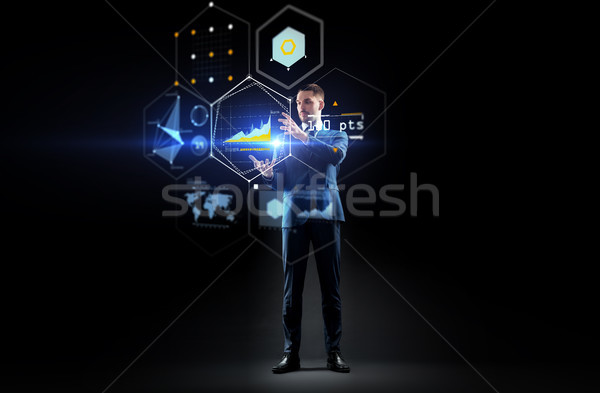 businessman working with charts on virtual screen Stock photo © dolgachov