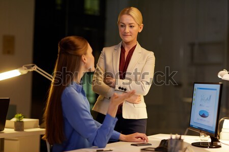 businesswoman at computer working at night office Stock photo © dolgachov