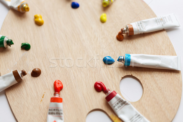 palette and acrylic color tubes or paint Stock photo © dolgachov