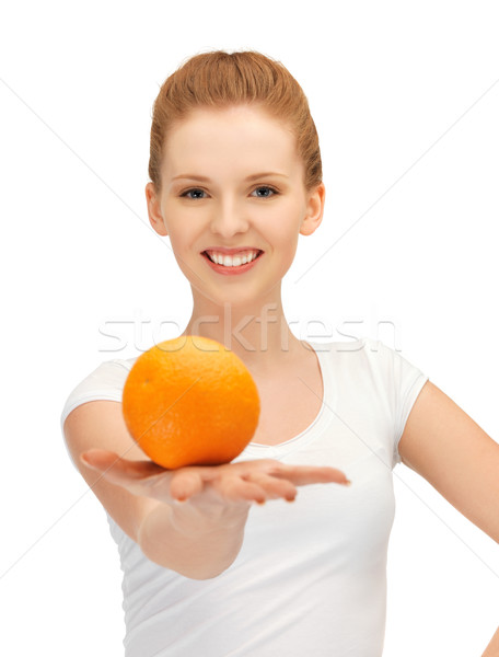 teenage girl with orange Stock photo © dolgachov