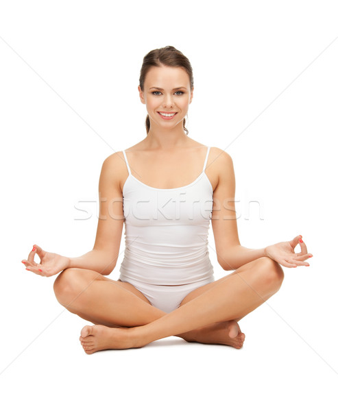 woman in cotton undrewear practicing yoga lotus pose Stock photo © dolgachov