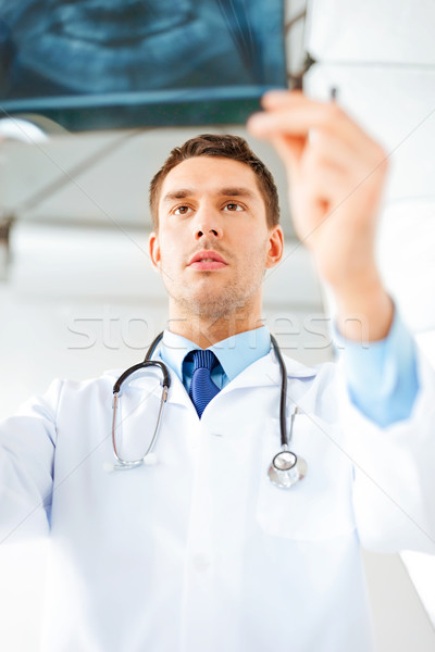Stock photo: male doctor or dentist looking at x-ray