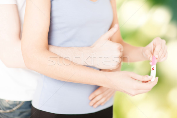 Stock photo: woman and man hands with pregnancy test