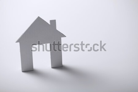 white paper house over white background Stock photo © dolgachov