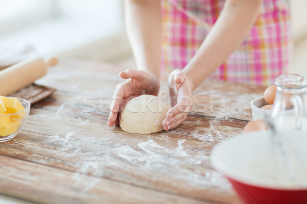 close up of female hands kneading dough at home Stock photo © dolgachov