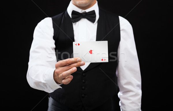 dealer holding white card Stock photo © dolgachov