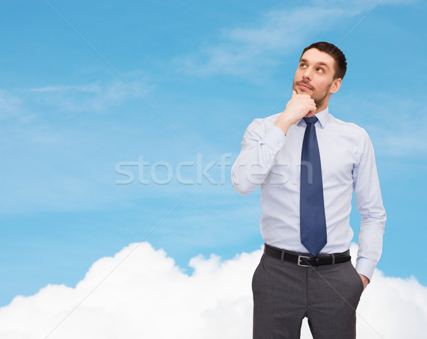 handsome businessman looking up Stock photo © dolgachov