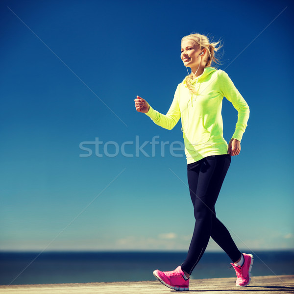 woman walking outdoors Stock photo © dolgachov