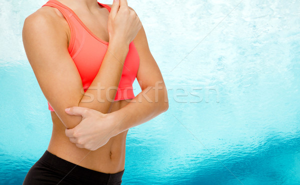 Stock photo: sporty woman with pain in elbow