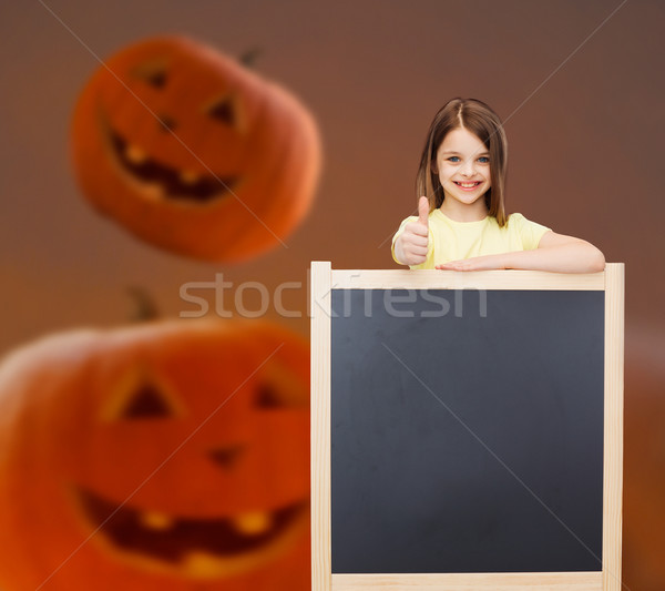 Souriant petite fille tableau noir publicité geste éducation [[stock_photo]] © dolgachov