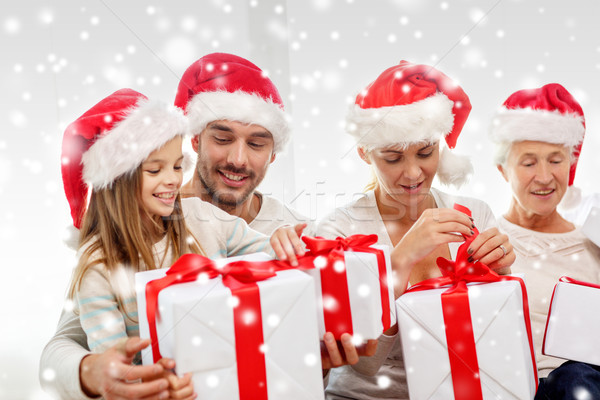 happy family sitting on couch at home Stock photo © dolgachov