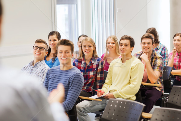 group of students and teacher with notebook Stock photo © dolgachov