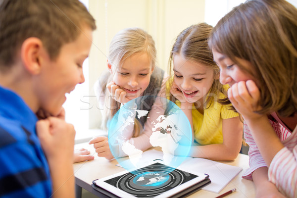 group of school kids with tablet pc in classroom Stock photo © dolgachov